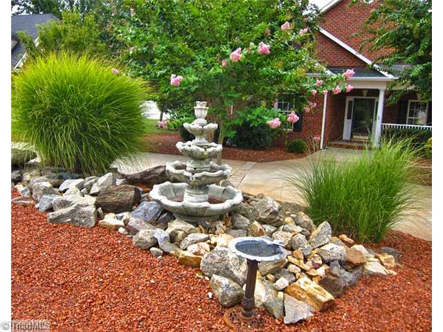 6330 Rustinburg Road Clemmons, NC 27012 - Photo 16 of 16 Landscaping. House features tons of landscaping for a great looking yard w/ minimal maintenance.
