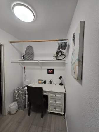 a room with a table and cabinets