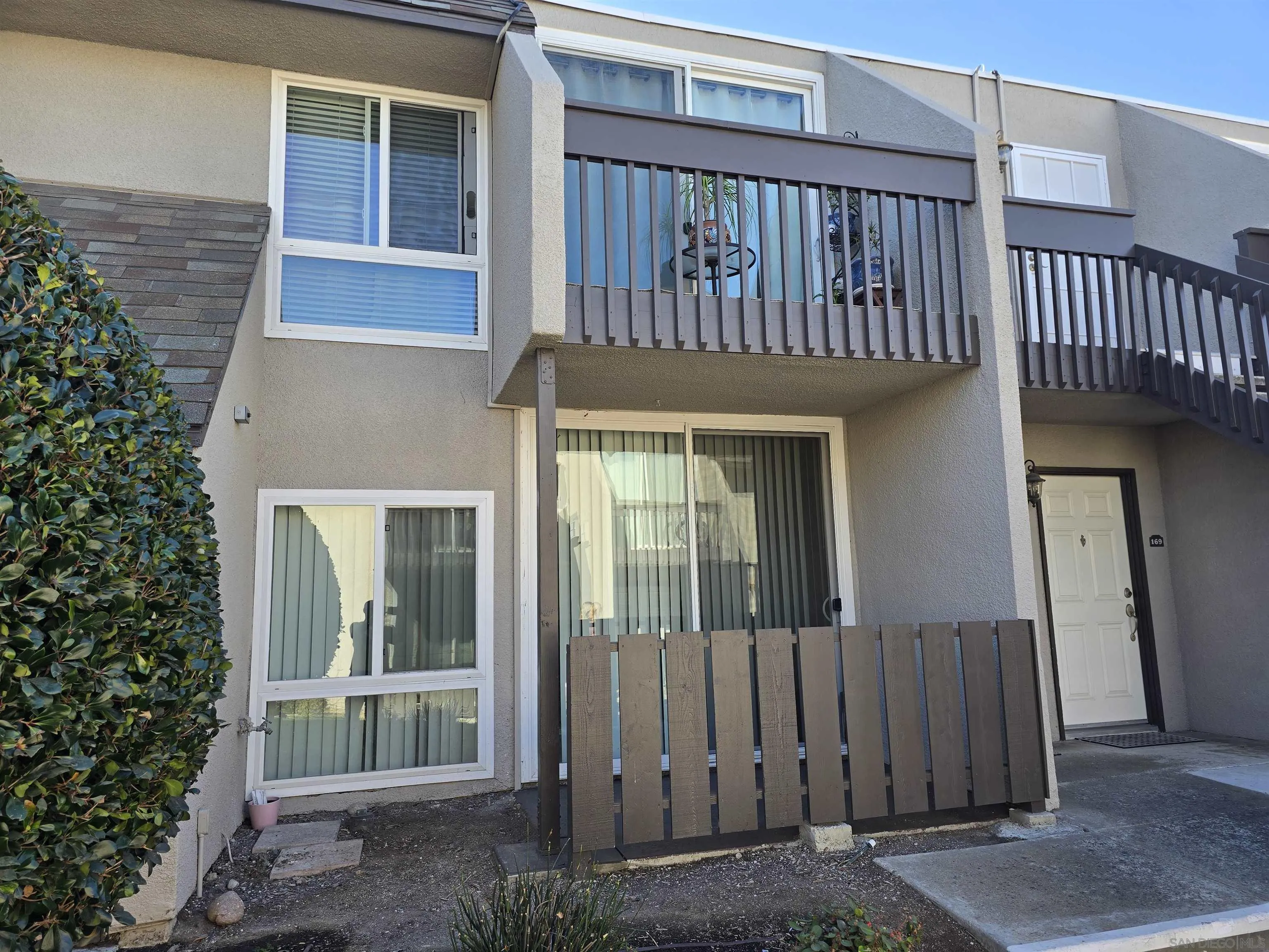 6333 Mt Ada Road, Unit 168 San Diego, CA 92111 - Photo 18 of 23 a view of a house with a porch