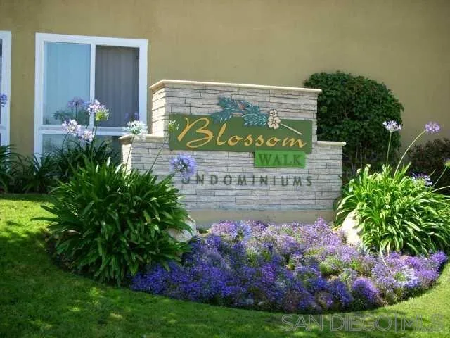 6333 Mt Ada Road, Unit 168 San Diego, CA 92111 - Photo 23 of 23 a sign that is in front of flowers