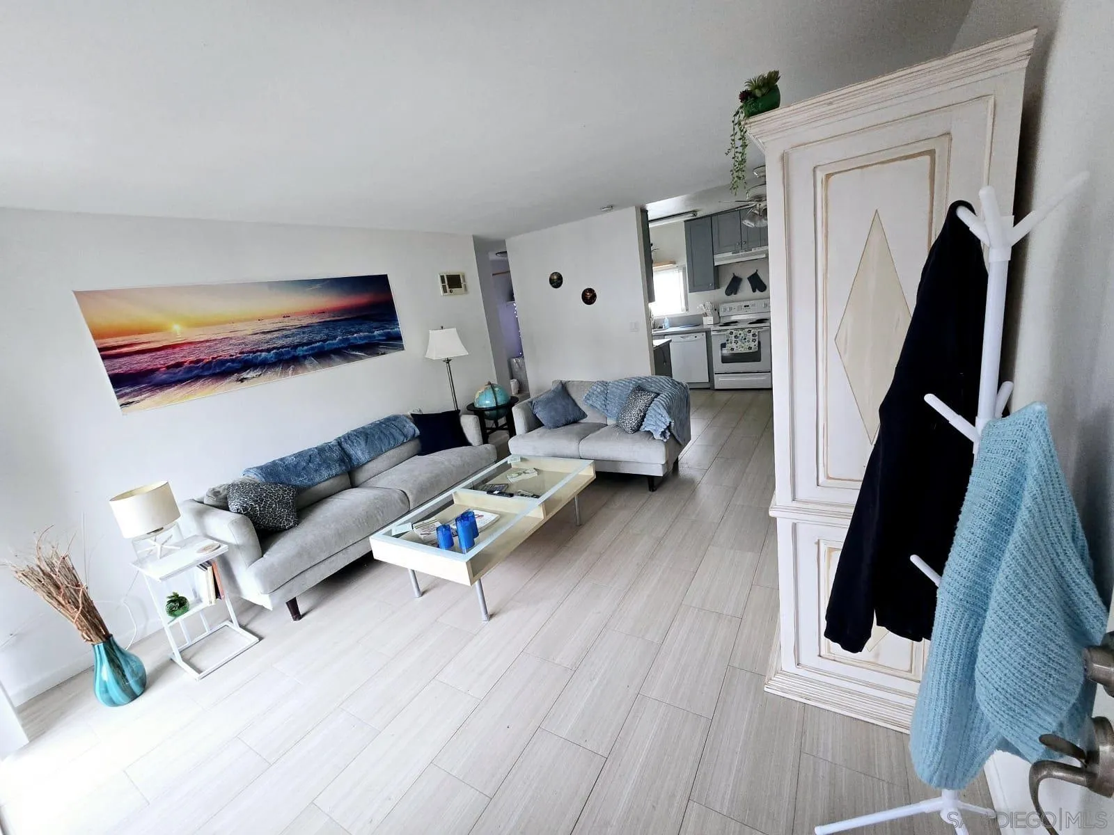 6333 Mt Ada Road, Unit 168 San Diego, CA 92111 - Photo 3 of 23 a living room with furniture and a flat screen tv