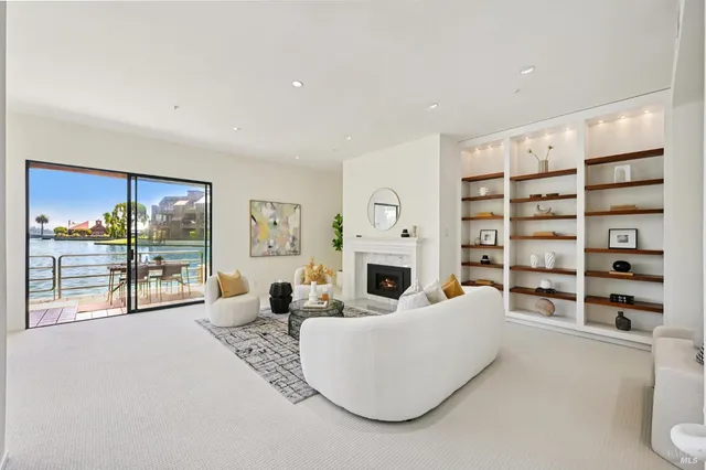 a living room with furniture cabinets and a flat screen tv