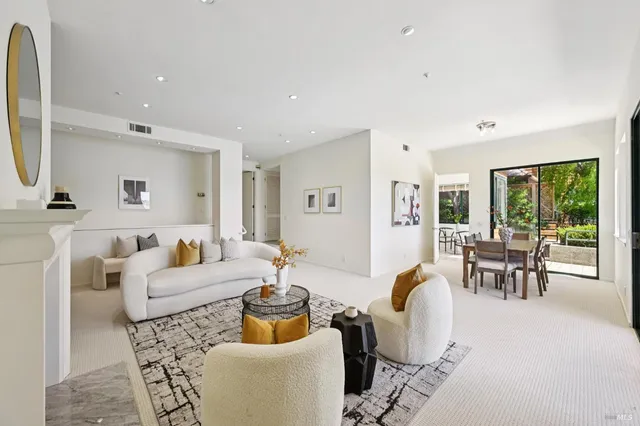 a dining room with furniture and front door