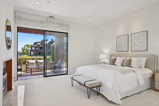 a roof deck with a couch and chairs