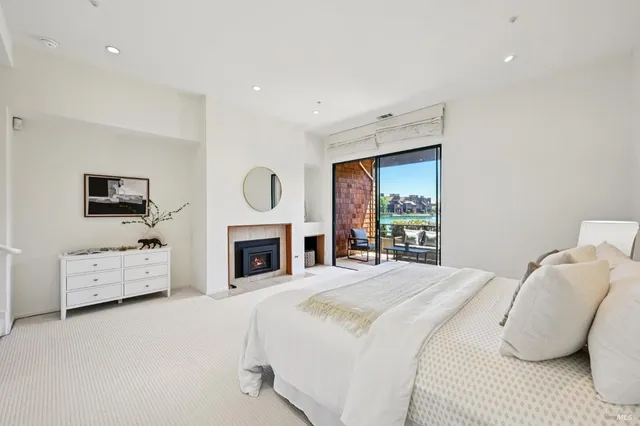 a spacious bathroom with a sink mirror and shower