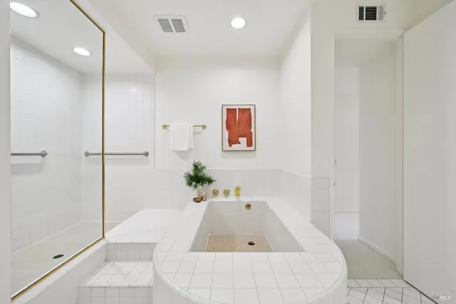 a bedroom with a bed and a table