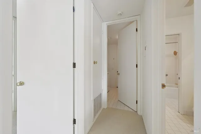 a dining room with furniture and a large window