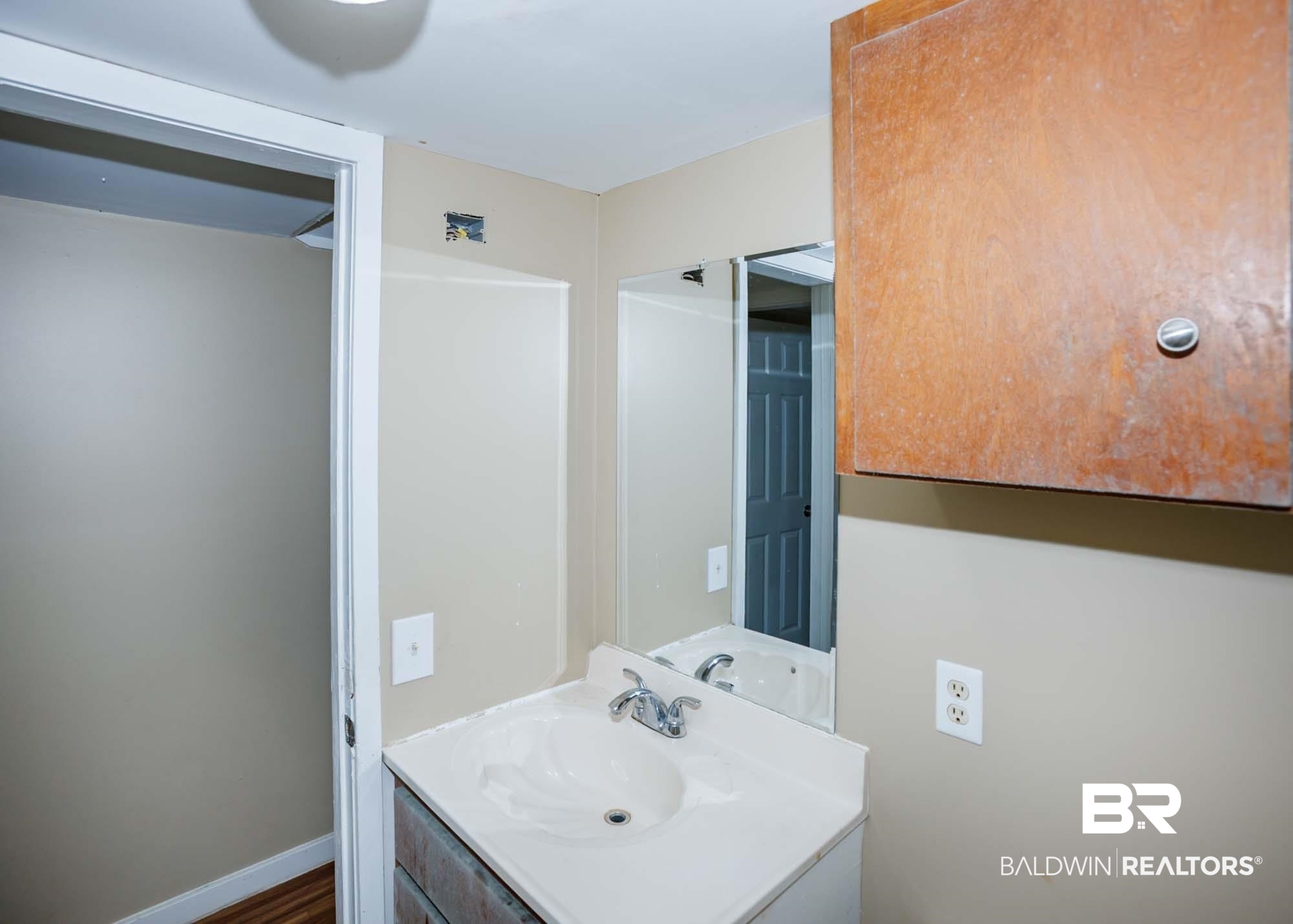 11998 Workman Avenue Foley, AL 36535 - Photo 55 of 59 Bathroom with vanity and wood finished floors
