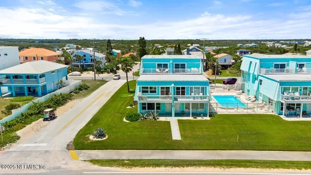 a view of a house with roof deck front of house
