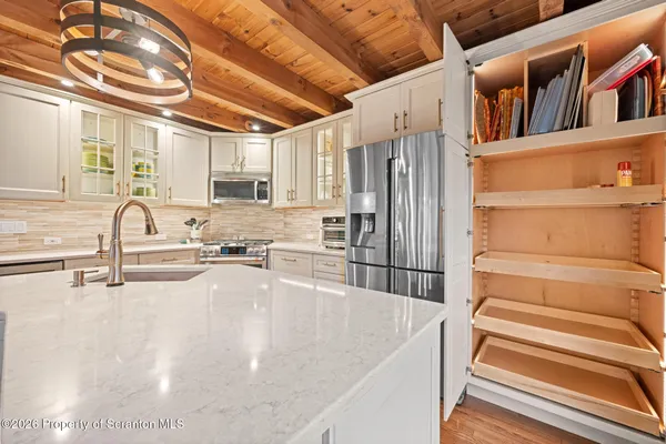 a bedroom with a bed and cabinets