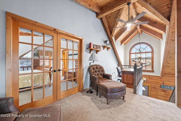 a view of a patio with table and chairs and potted plants