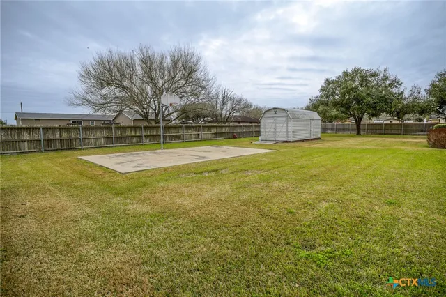 a view of a swimming pool with an outdoor space and seating area