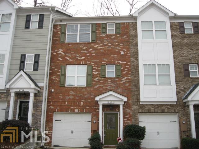 2990 Lauren Parc Road Decatur, GA 30032 - Photo 1 of 1 a front view of a house with a yard and garage