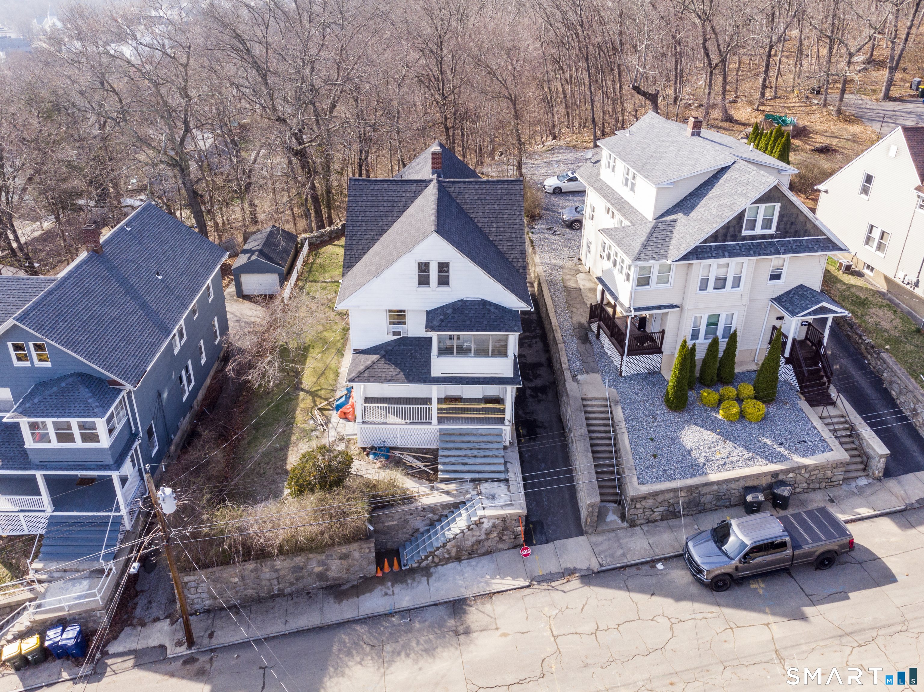 19-21 Ells Street Ansonia, CT 06401 - Photo 13 of 15 a view of a house with iron fence