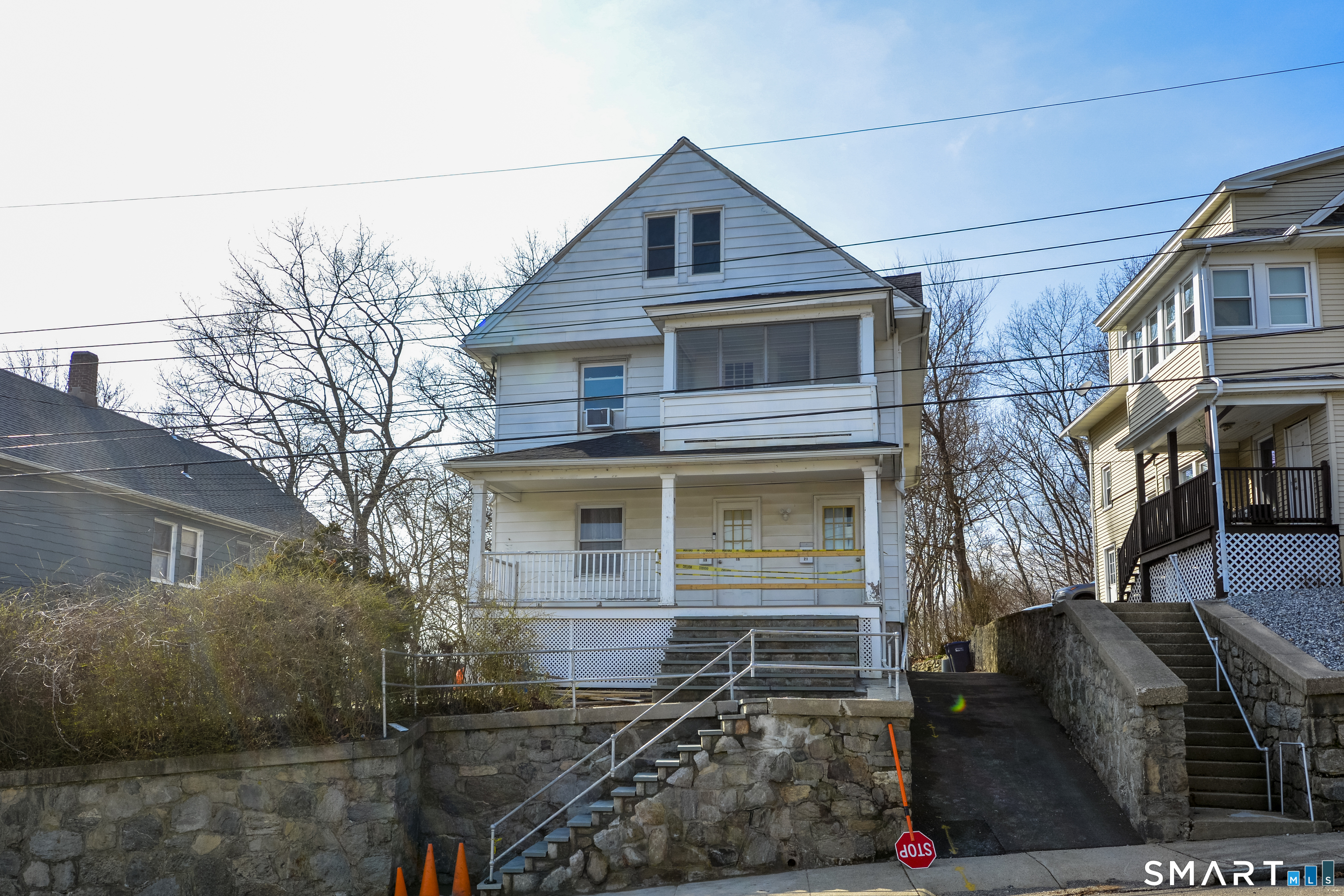19-21 Ells Street Ansonia, CT 06401 - Photo 2 of 15 a front view of a house with garage