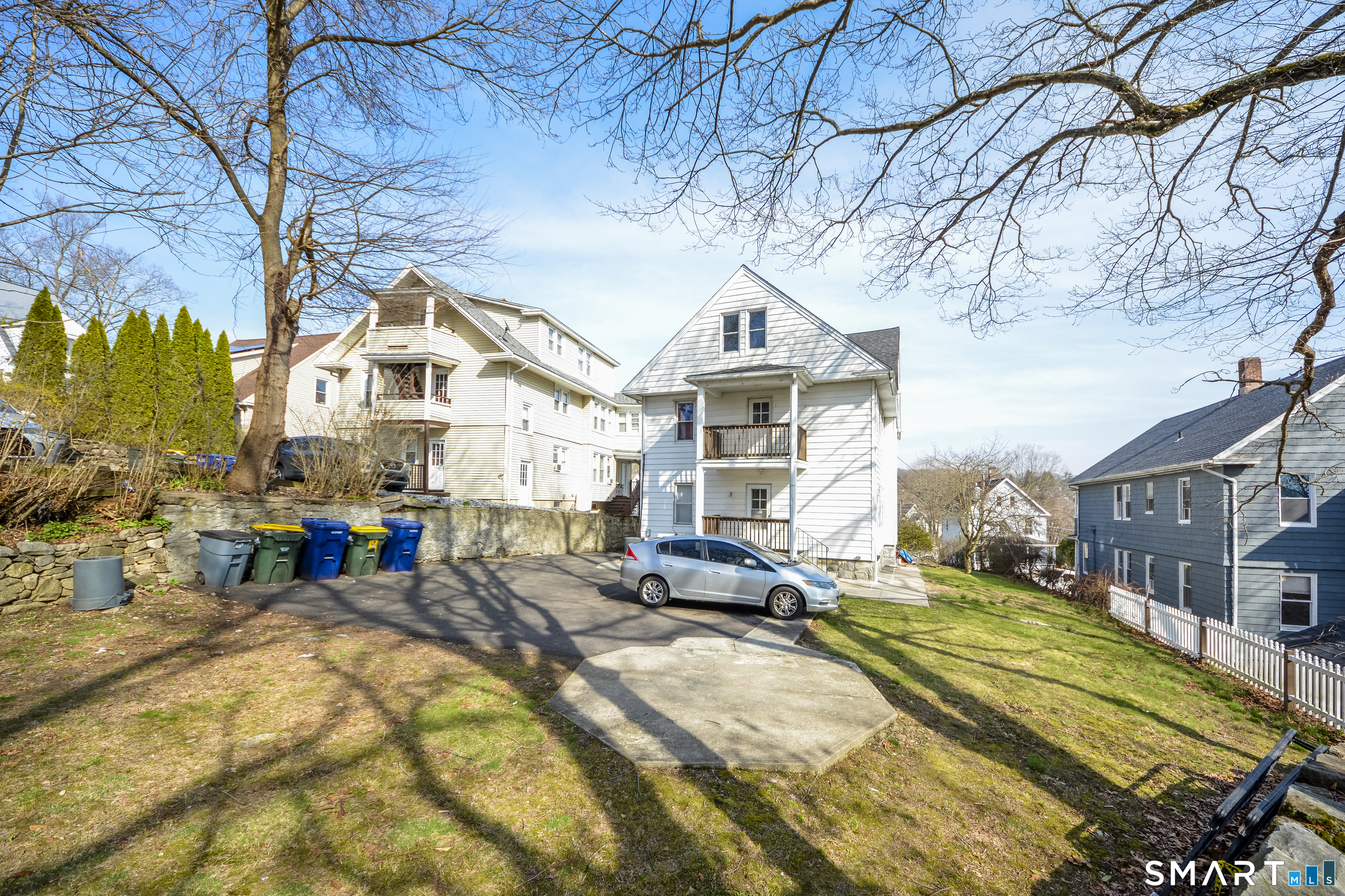 19-21 Ells Street Ansonia, CT 06401 - Photo 3 of 15 a view of a house with a large tree in front of it