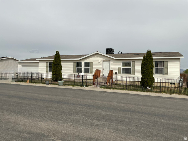 316 West 2000th Street South Vernal, UT 84078 - Photo 1 of 1 View of front of home with a fenced front yard