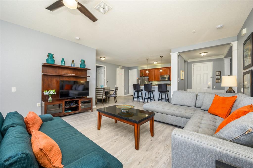 5012 Shoreway Loop, Unit 20507 Orlando, FL 32819 - Photo 11 of 49 a living room with furniture and a flat screen tv