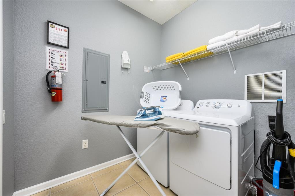 5012 Shoreway Loop, Unit 20507 Orlando, FL 32819 - Photo 16 of 49 a utility room with dryer and washer