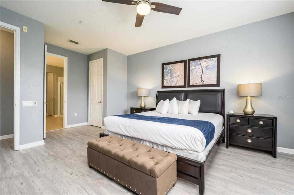 5012 Shoreway Loop, Unit 20507 Orlando, FL 32819 - Photo 20 of 49 a bedroom with bed and window