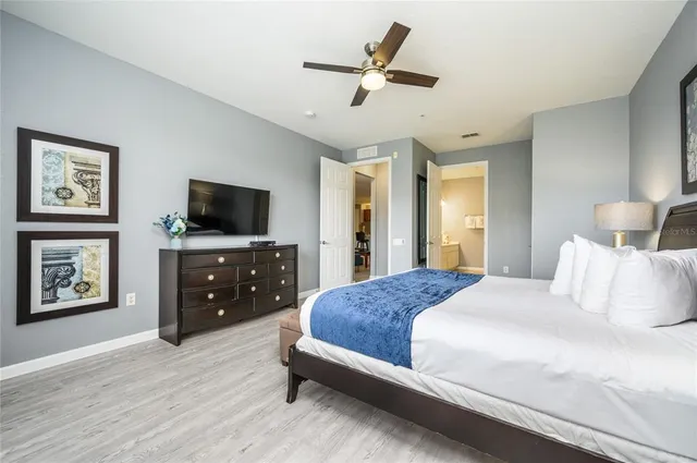 a kitchen with stainless steel appliances kitchen island granite countertop a table and chairs in it
