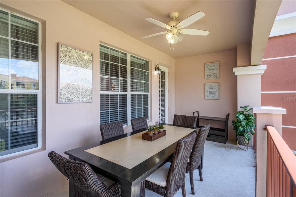 5012 Shoreway Loop, Unit 20507 Orlando, FL 32819 - Photo 29 of 49 a view of a dining room with furniture window and wooden floor
