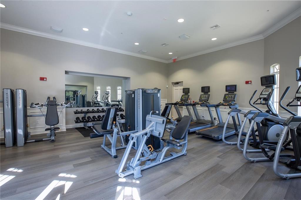 5012 Shoreway Loop, Unit 20507 Orlando, FL 32819 - Photo 46 of 49 a view of a room with gym equipment