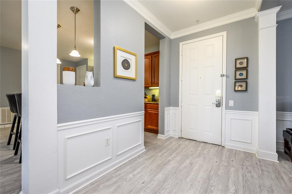 5012 Shoreway Loop, Unit 20507 Orlando, FL 32819 - Photo 6 of 49 wooden floor in an empty room and a window