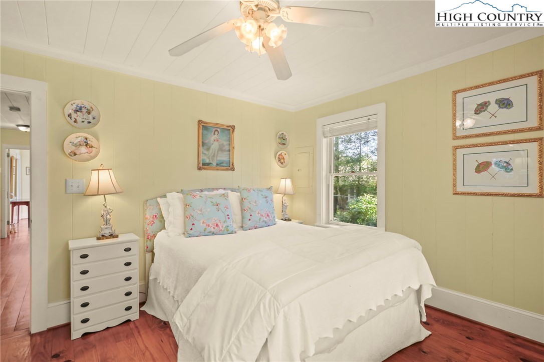 326 Ransom Street Blowing Rock, NC 28605 - Photo 12 of 25 a bedroom with a bed and a window