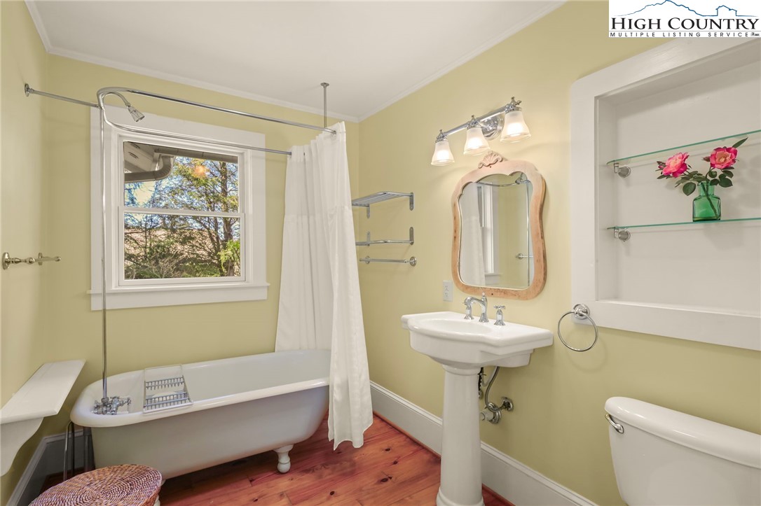 326 Ransom Street Blowing Rock, NC 28605 - Photo 14 of 25 a bathroom with a sink mirror and toilet