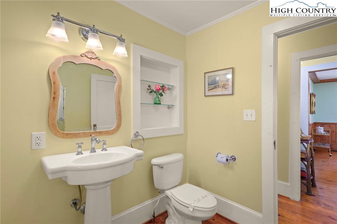 326 Ransom Street Blowing Rock, NC 28605 - Photo 15 of 25 a bathroom with a toilet sink and mirror