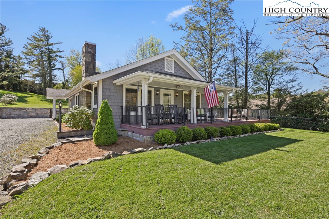 326 Ransom Street Blowing Rock, NC 28605 - Photo 21 of 25 a view of a house with a big yard plants and large trees