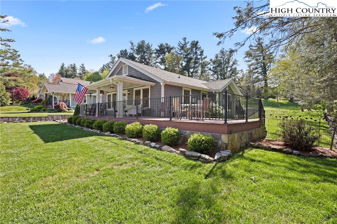326 Ransom Street Blowing Rock, NC 28605 - Photo 3 of 25 a front view of a house with a yard and potted plants