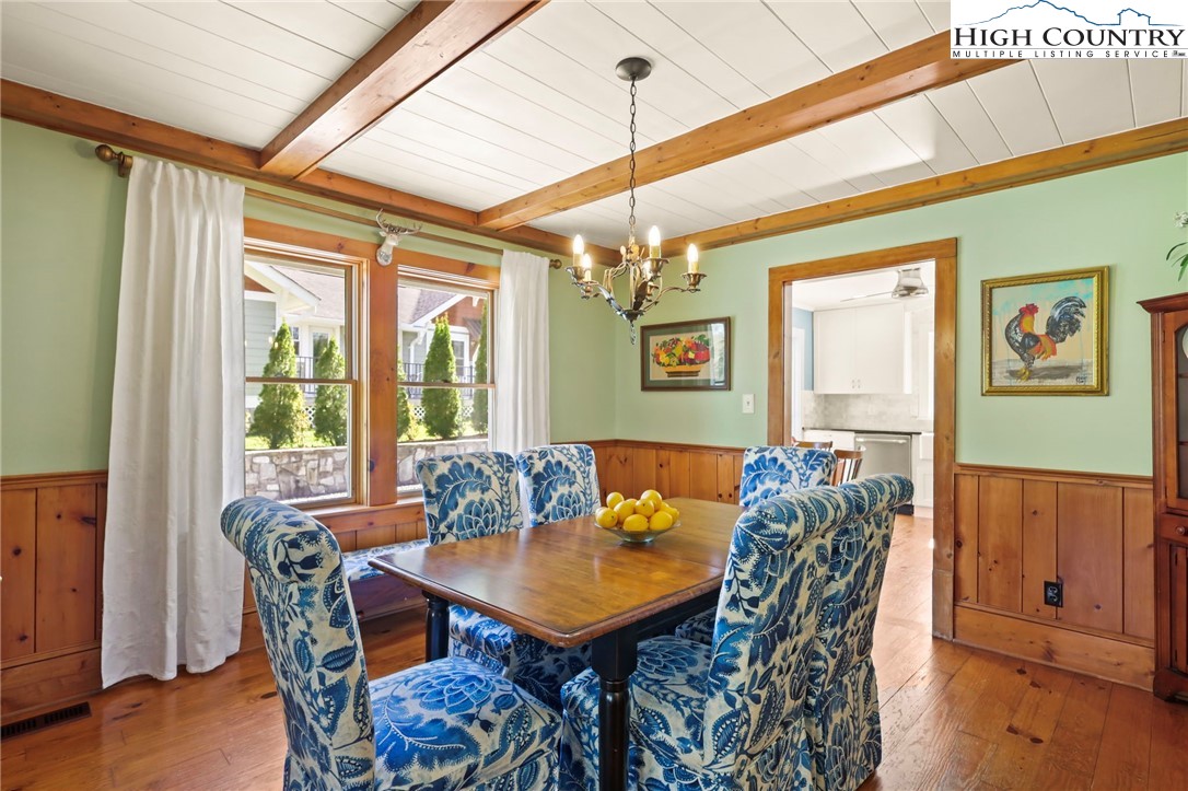 326 Ransom Street Blowing Rock, NC 28605 - Photo 10 of 25 a view of a dining room with furniture window and wooden floor