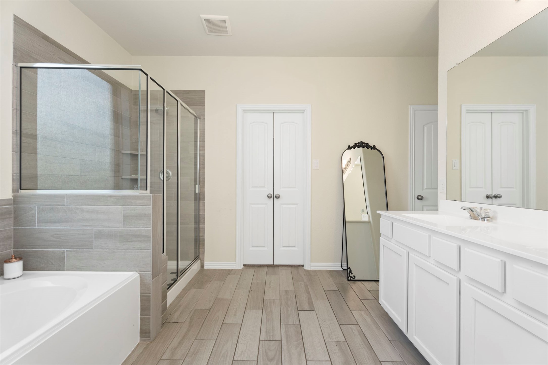 4710 Walnut Willow Ct Spring Spring, TX 77386 - Photo 17 of 42 Primary bedroom ensuite with double sinks, soaking tub and separate shower.