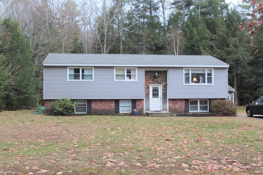 117 Sherbert Road Ashburnham, MA 01430 - Photo 1 of 9 a front view of a house with a yard
