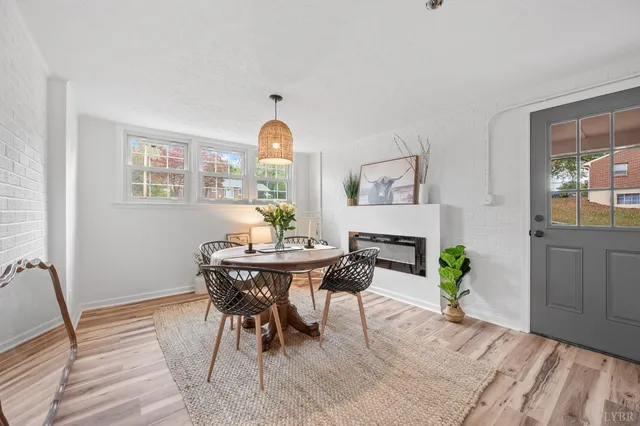 a dining room with furniture and window