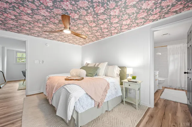 a bathroom with a granite countertop sink a toilet and a mirror