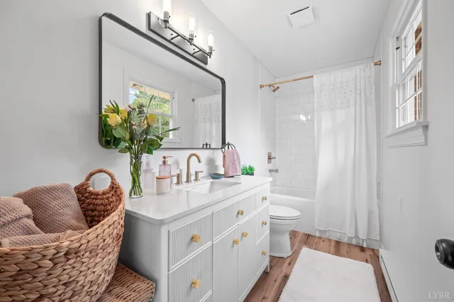 a bathroom with a shower curtain and a bathtub
