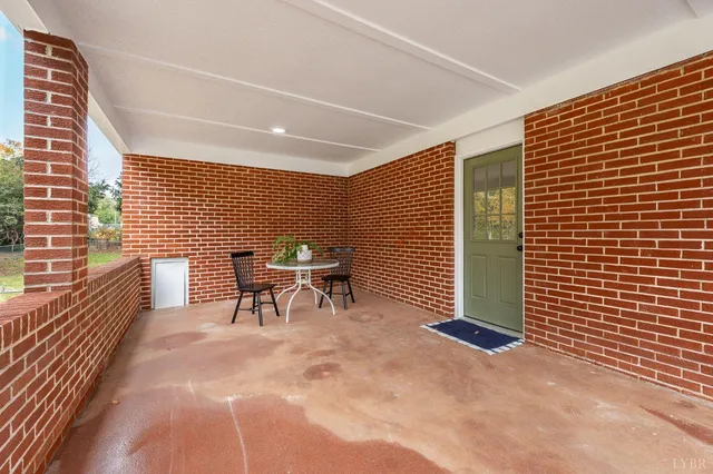 a view of a two chairs in the balcony