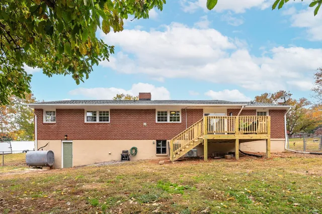 a view of a swimming pool and trees in the background