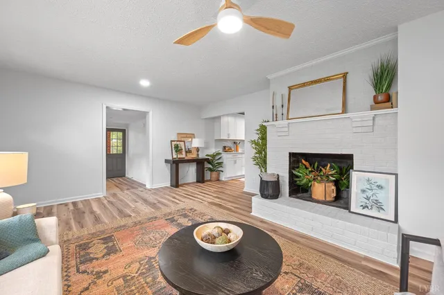 a living room with furniture and a fireplace