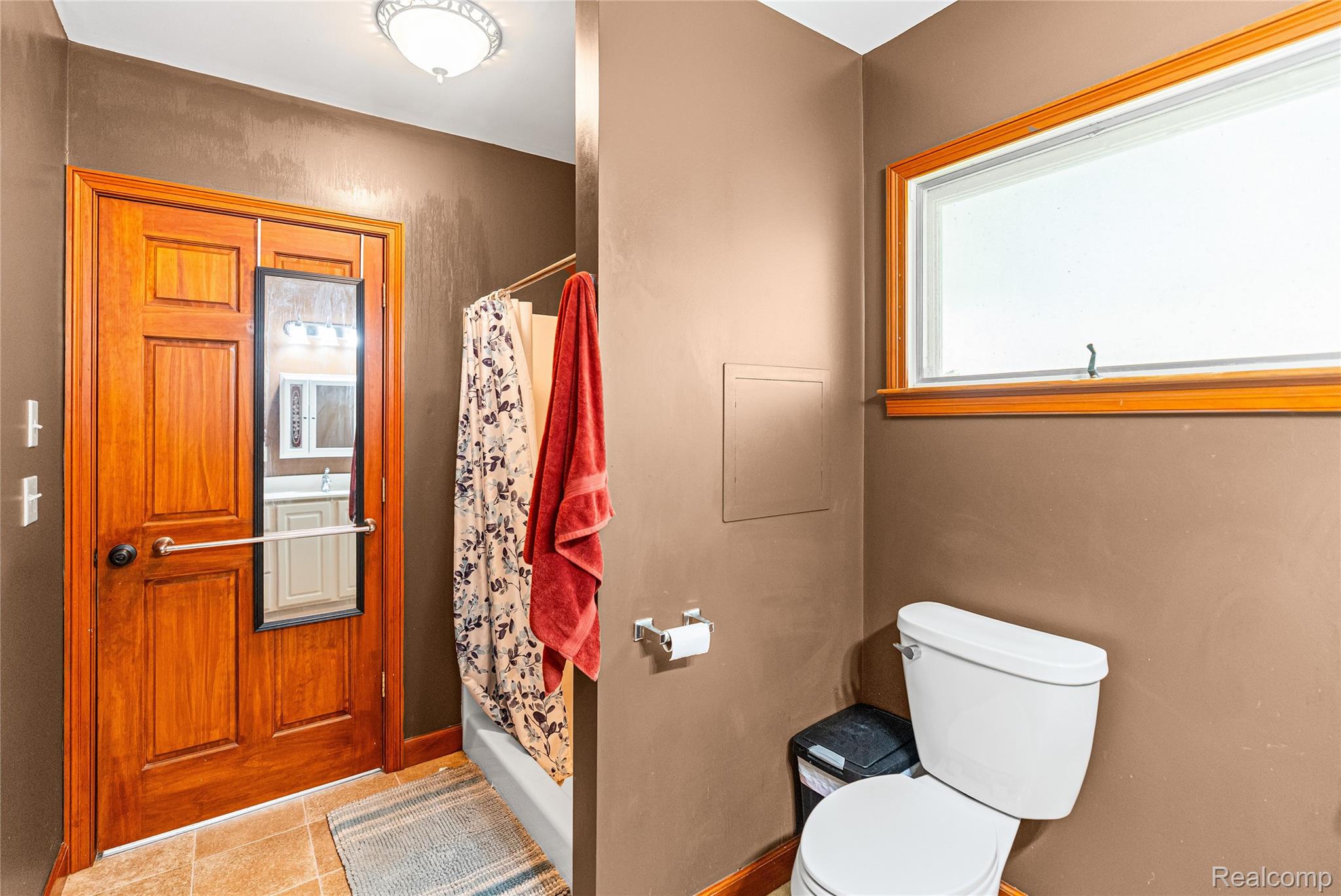 6383 Lapeer Road Burton, MI 48509 - Photo 20 of 44 Bathroom featuring a stall shower and toilet