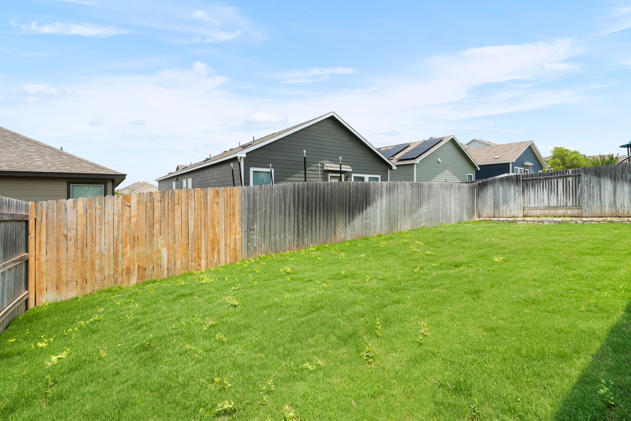 313 Mclintock Road Jarrell, TX 76537 - Photo 32 of 40 A fenced backyard offers abundant space for outdoor activities and private enjoyment.