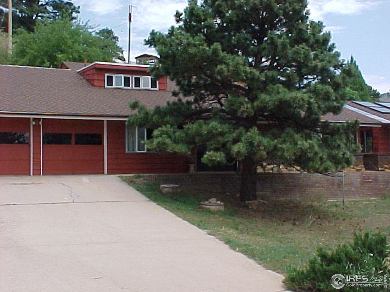 5267 Olde Stage Road Boulder, CO 80302 - Photo 1 of 17 a front view of a house with a yard and garage