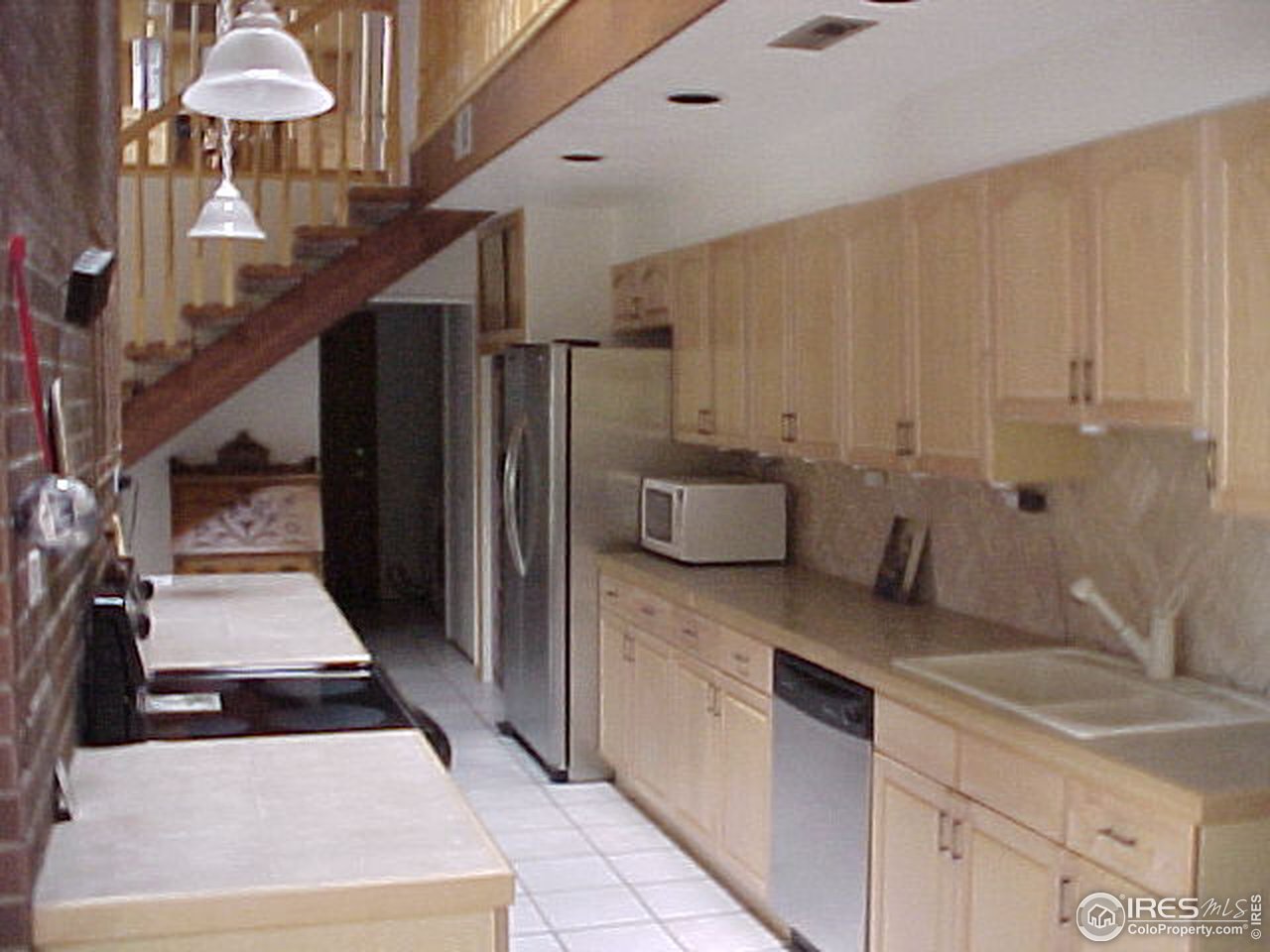 5267 Olde Stage Road Boulder, CO 80302 - Photo 4 of 17 a kitchen with stainless steel appliances a counter space and cabinets