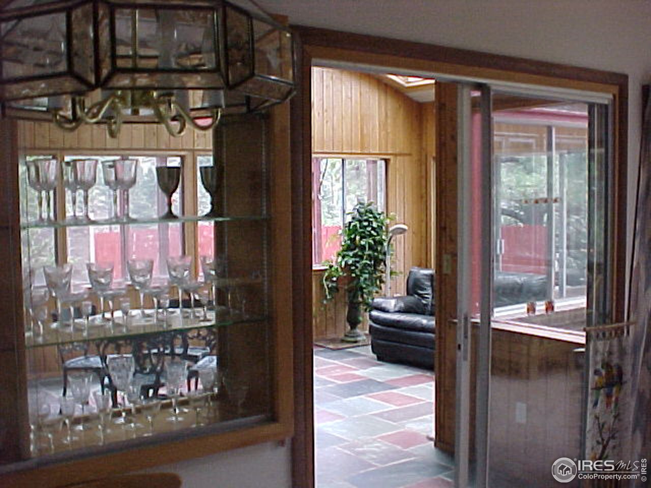 5267 Olde Stage Road Boulder, CO 80302 - Photo 6 of 17 a hallway with a dining table and chairs