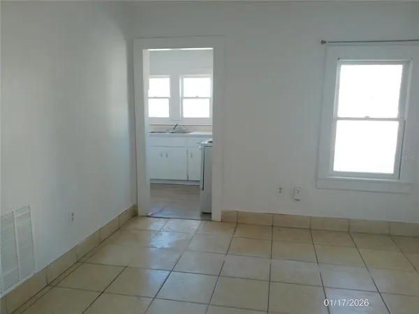 a view of an empty room with a window