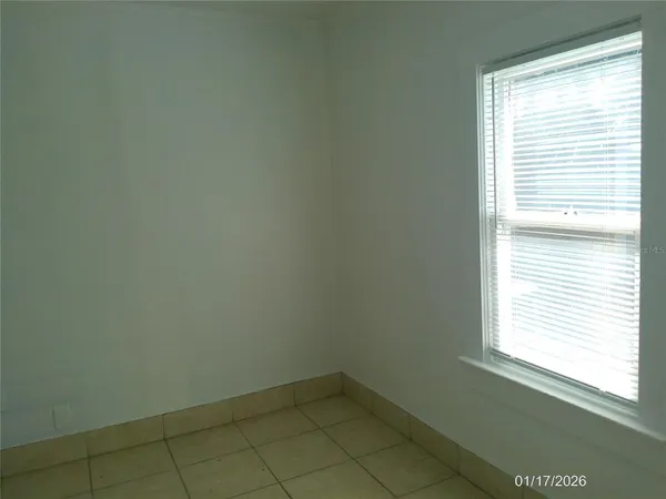 a view of a house with backyard and garden