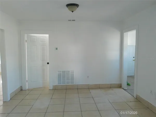 an empty room with a bench